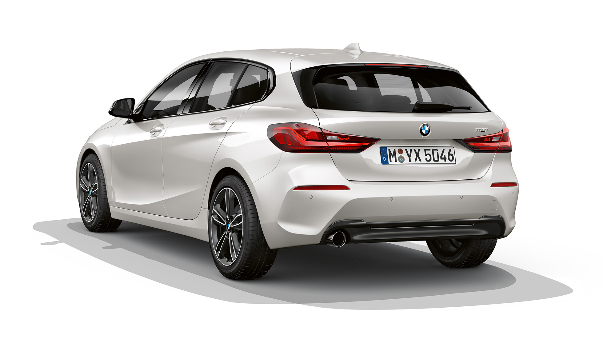 BMW 1 Series Model Sport Line in Mineral White metallic, studio shot three-quarter rear.