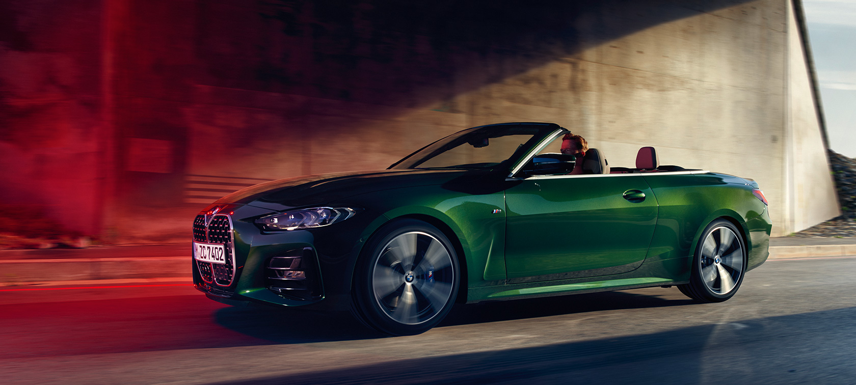 BMW 4 Series Convertible G23 2020 Sanremo Green metallic three-quarter side view in motion