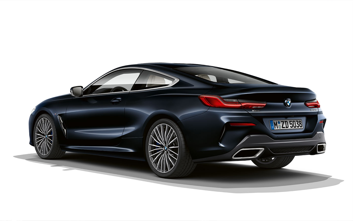 Still shot of the BMW 8 Series Coupé in Carbon Black metallic against a white background.