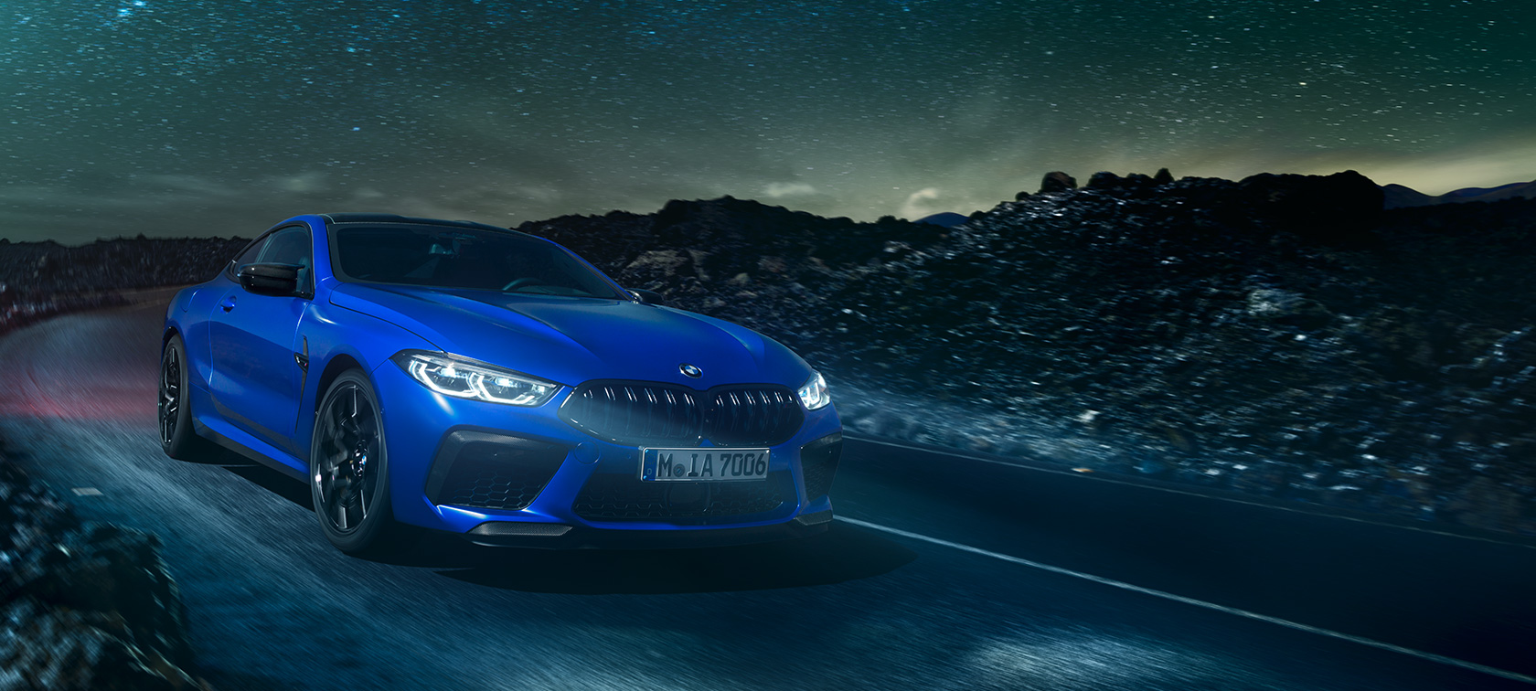 The first-ever BMW M8 Competition Coupé in Marina Bay Blue metallic, three-quarter front view.