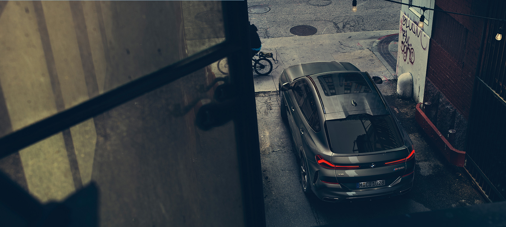 BMW X6 rear view from bird's eye view.